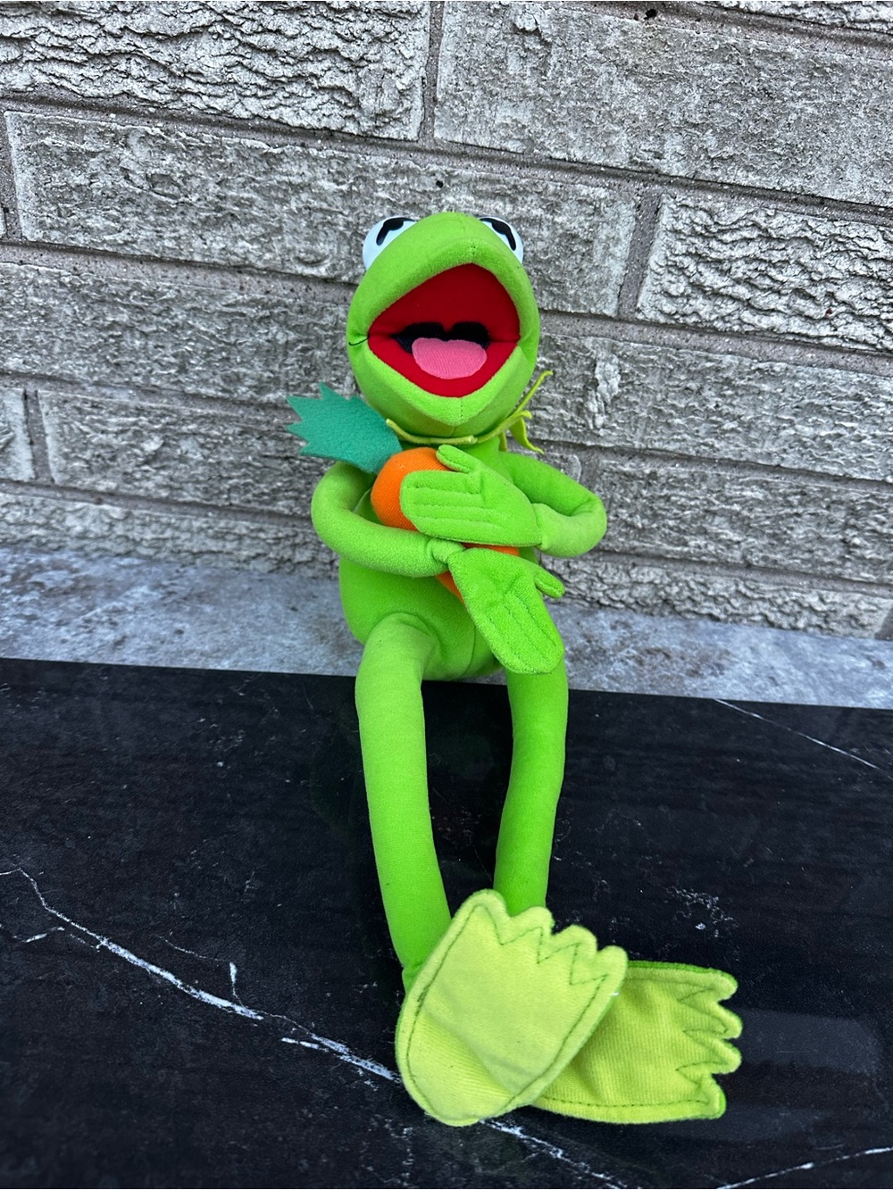 Nanco Kermit the Frog Plush holding a small felt carrot